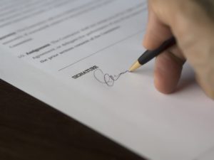 A contract being signed